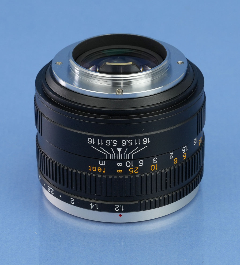 KONICA HEXANON 60MM F1.2 LEICA NOCTILUX OBJEKTIV + DECKEL + FILTER + BOX + SUCHER NEUWERTIGES SET